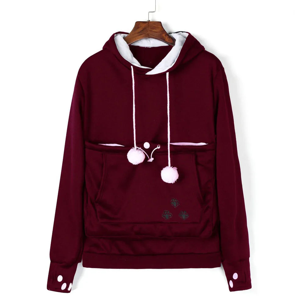 Burgundy pet carrier kangaroo sweatshirt with a cozy hood and pom-pom details