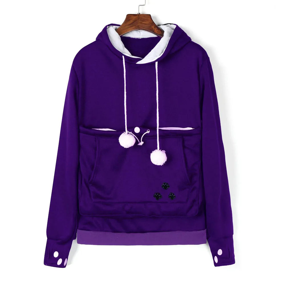 Purple pet carrier kangaroo sweatshirt with pom poms and paw print design for cozy pet transport