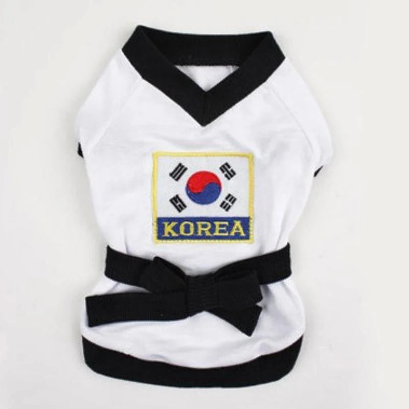 Pet karate costume Halloween featuring a white outfit with Korean flag and black belt from Zoomies & Co