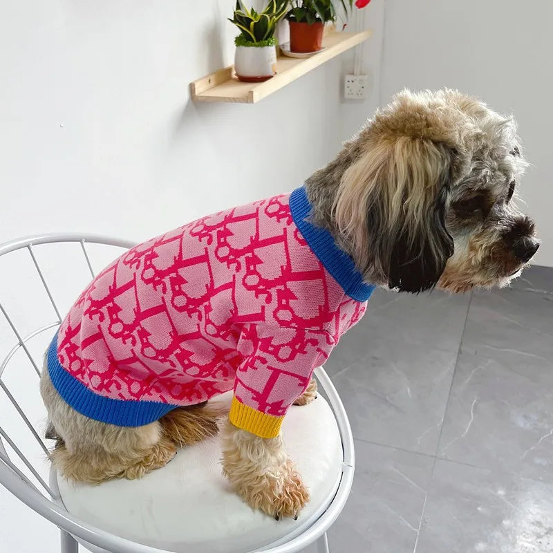 Cute pink dog sweater for small dogs with colorful accents, perfect for stylish pets