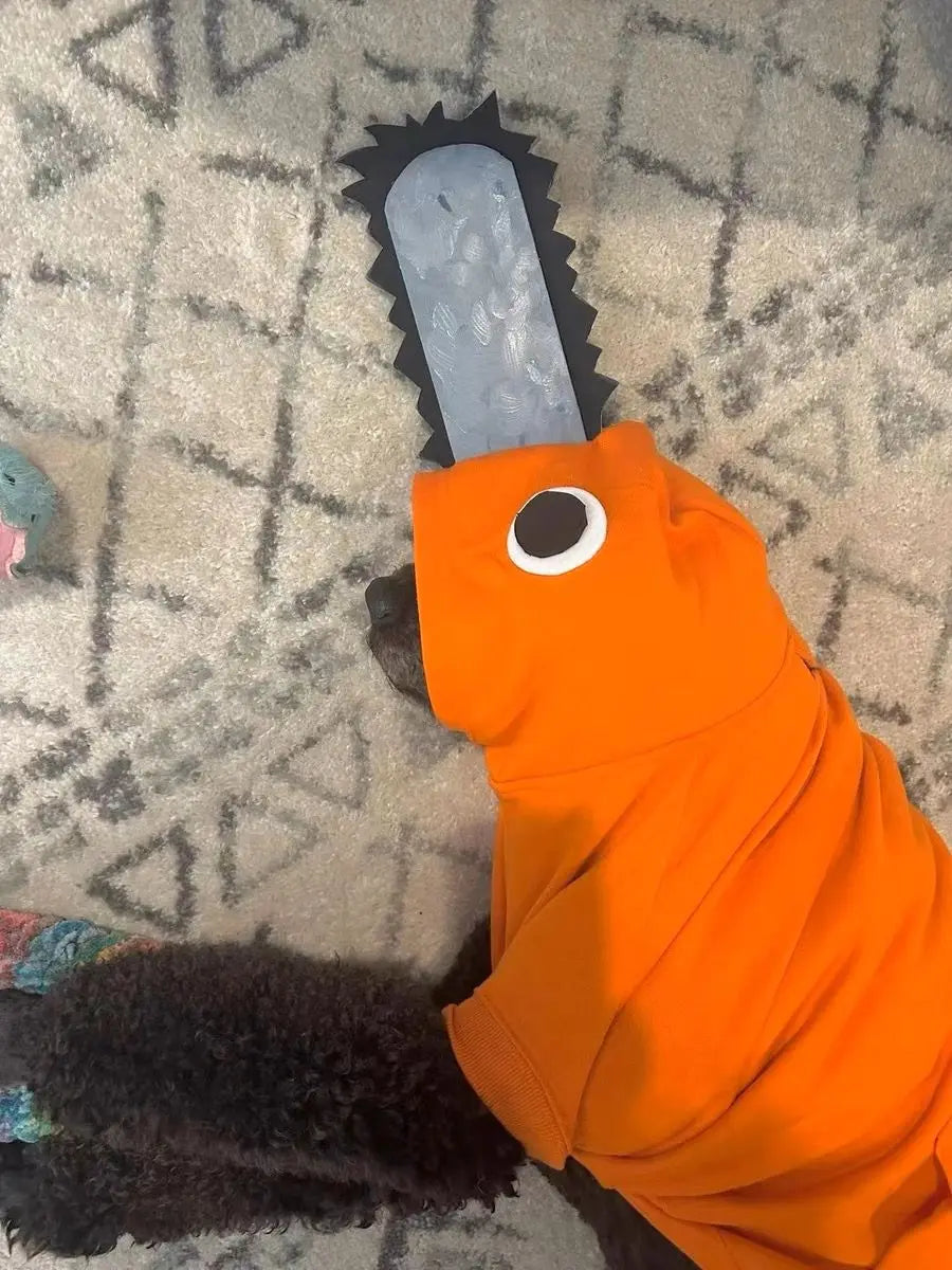 Dog in an orange Pochita pet outfit for dogs with a chainsaw design on the hood, perfect for playful pets