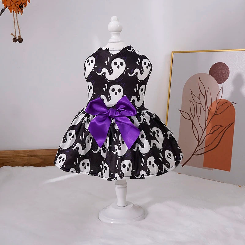 Adorable pumpkin pet skirt for dogs featuring ghost patterns and a purple bow for Halloween celebrations