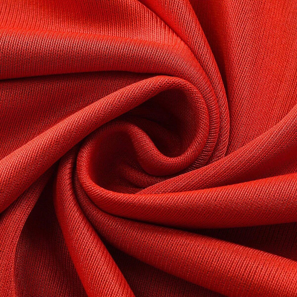 Red fabric swirl showcasing a reversible vampire cape for adults and kids by Zoomies & Co