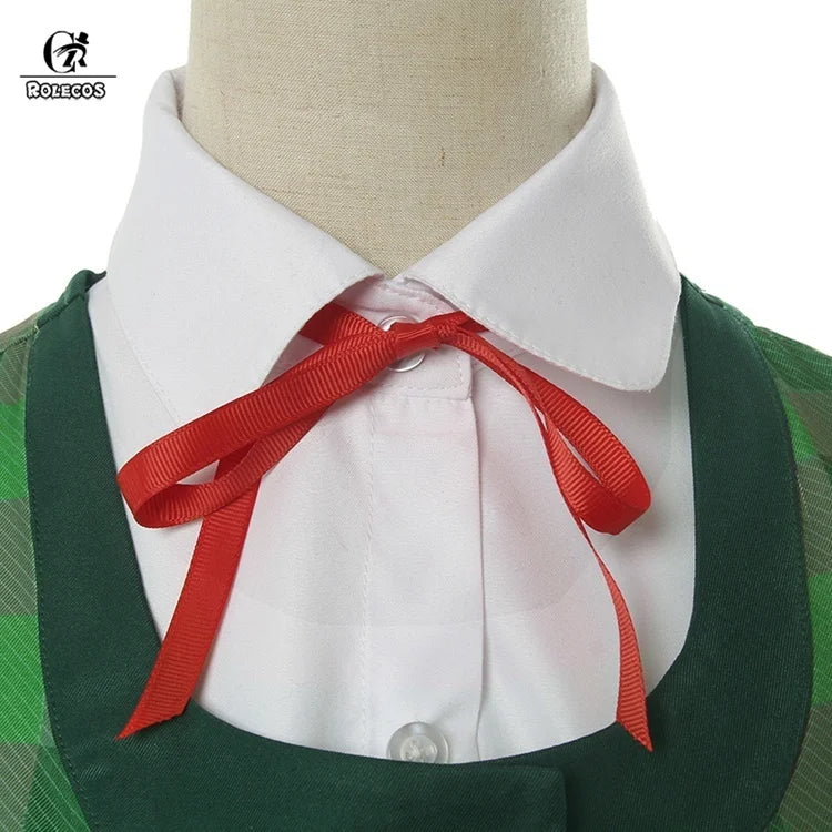 Close-up of a collar and red bow from an Animal Crossing New Horizons outfit with a green patterned design