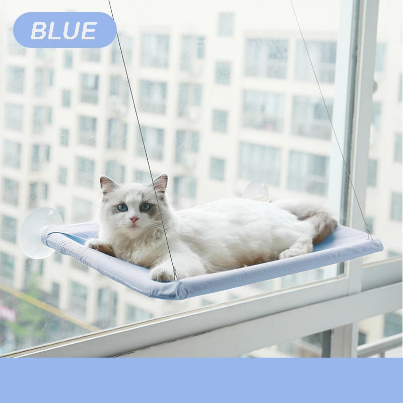 SkyLounge Window Cat Hammock in blue with a cozy cat lounging on a sunny window ledge