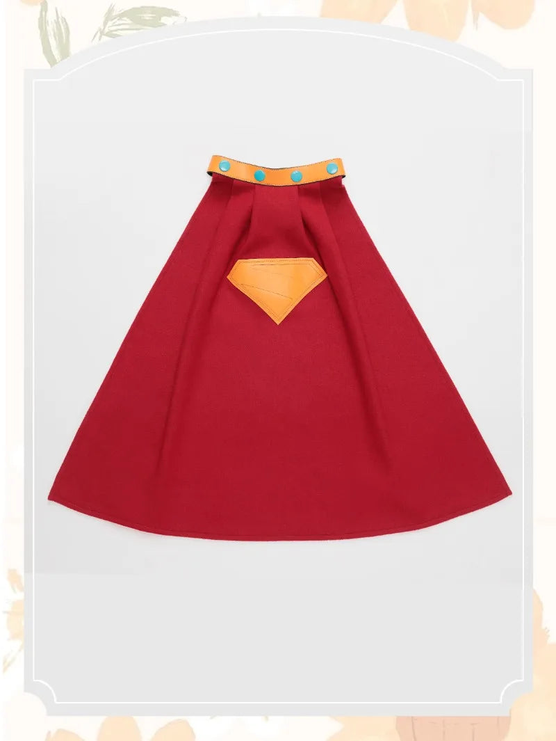 Red superhero cape with an orange chest emblem and blue buttons for kids by Zoomies & Co