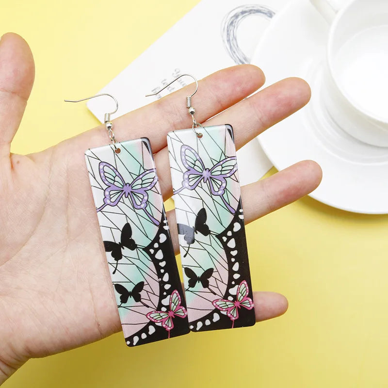 Colorful Tanjiro earrings Demon Slayer featuring butterfly and floral designs for anime fans