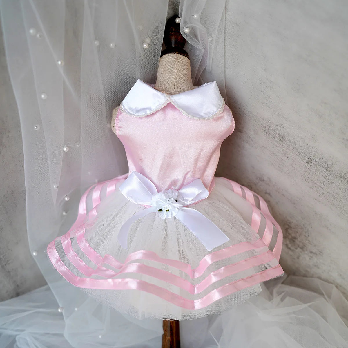Yorkie summer princess dress in pink with a white tulle skirt and decorative bow for stylish pets