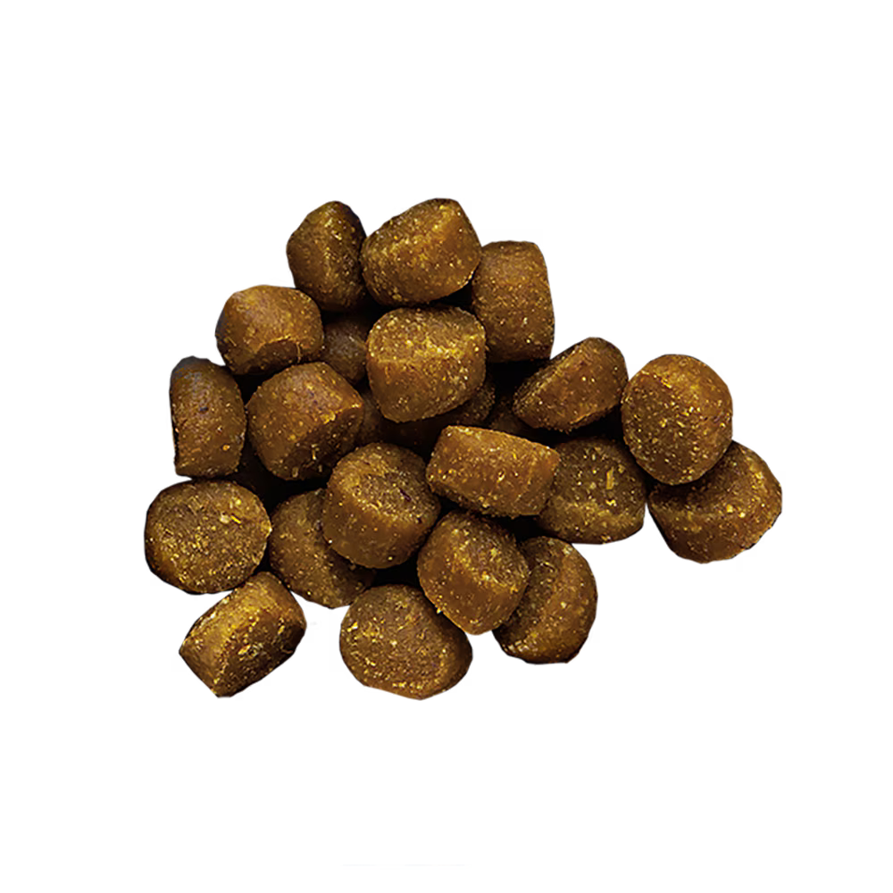 Zukes mini beef dog treats shown in a close-up with a black background